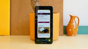 CMF Phone 2 Pro leaning against a plant pot, display showing the Essential Space screenshot feature