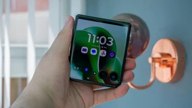 Motorola Razr 60 Ultra folded in hand, front view with the cover display on