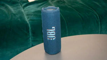 JBL Flip 7 speaker on desk in vertical orientation