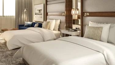 Bedroom at the Intercontinental Barcelona with two beds and white linen