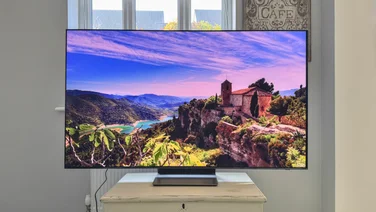 The Samsung S90F TV on a drawer unit shot from the front