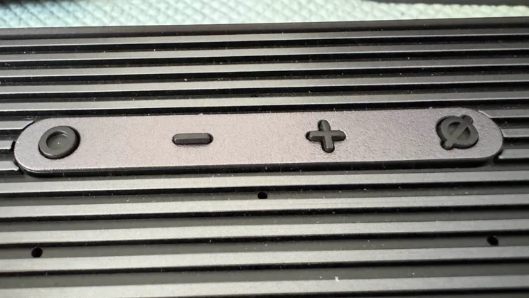 Close-up of the physical controls found on top of the soundbar component of the Samsung HW-Q990F home audio system
