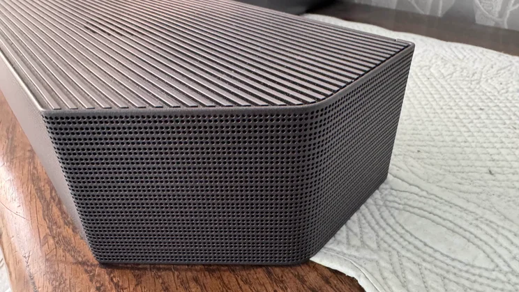 Close-up of the speaker grille detail on the soundbar of the Samsung HW-Q990F home audio system