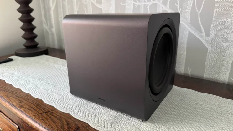 The subwoofer component of the Samsung HW-Q990F home audio system pictured from the left-hand side