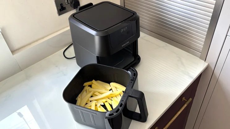Uncooked chips inside the drawer of the Instant Pot Vortex Compact 5L air fryer