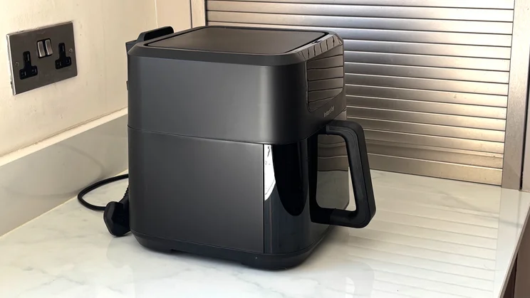 A side view of the Instant Pot Vortex Compact 5L air fryer on a kitchen counter