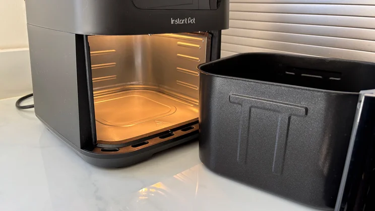 The inside of the Instant Pot Vortex Compact 5L air fryer, with the internal light switched on