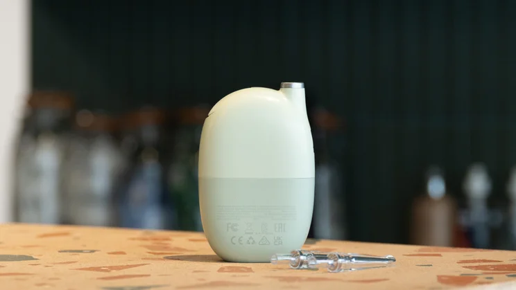 The Oclean AirPump Water Flosser A10, , without nozzle inserted, on a table