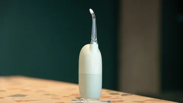 The Oclean AirPump Water Flosser A10 on a table