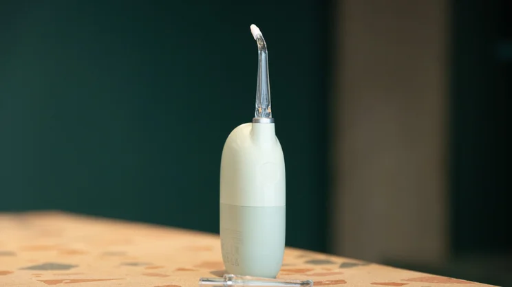 The Oclean AirPump Water Flosser A10 on a table