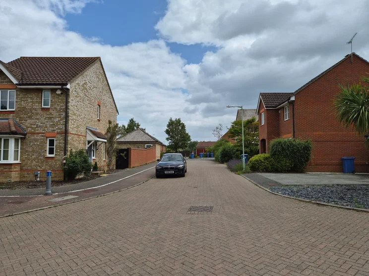 A quiet street with houses on either side