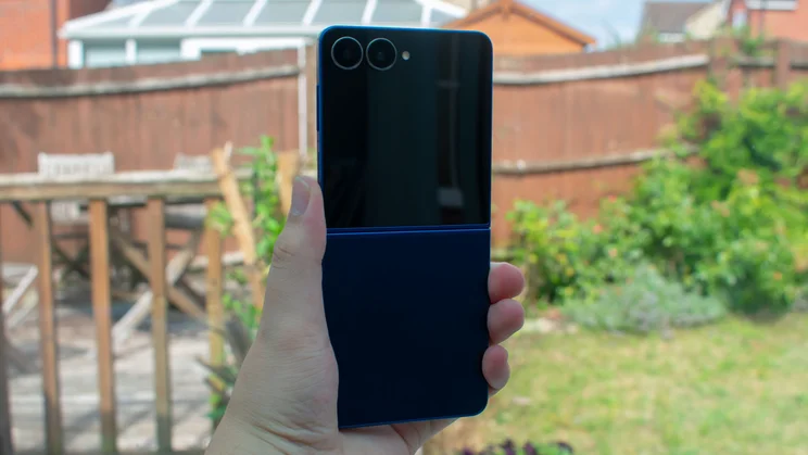 Samsung Galaxy Z Flip 7 unfolded in hand, rear view