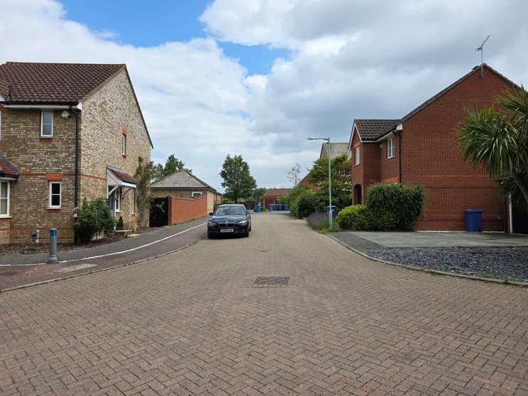 A quiet road with houses on both sides