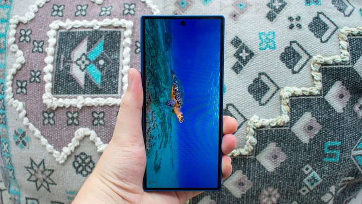 Samsung Galaxy Z Fold 7 folded in hand, showing an underwater scene on the cover display