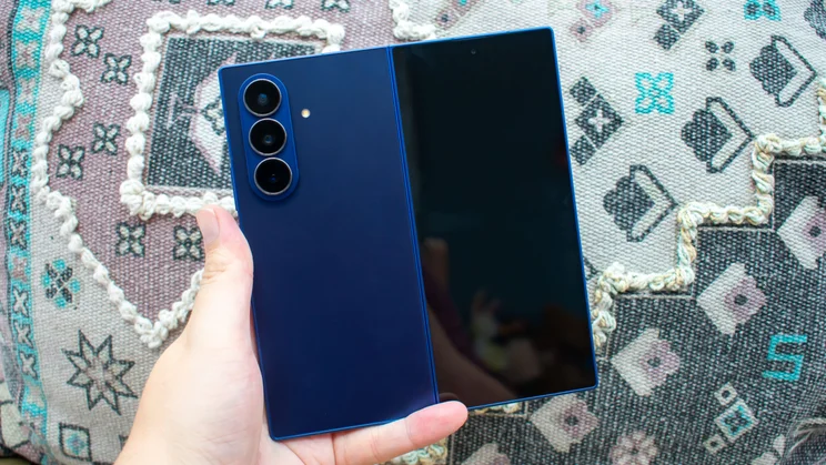 Samsung Galaxy Z Fold 7 unfolded in hand, rear view, with the cover display off