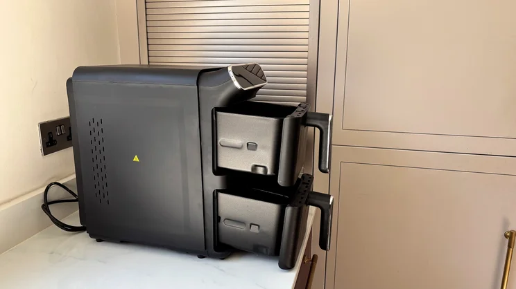 Tower Vortx 11 Litre Dual Layer air fryer on a kitchen counter, its drawers pulled out