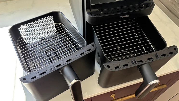 A view inside the drawers of the Tower Vortx 11 Litre Dual Layer air fryer, with cooking racks inserted
