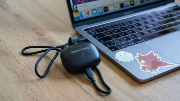 The Bowers & Wilkins Pi8 wireless earbuds case being used as a wireless transmitter when connected to a laptop