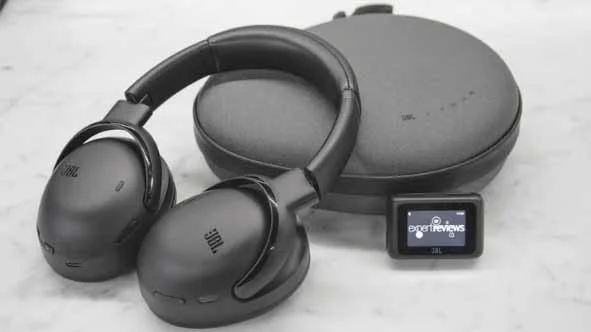 The JBL Tour One M3 over-ear headphones with their carrying case and Smart TX wireless transmitter