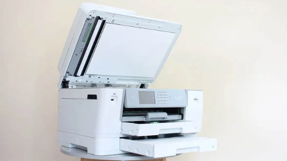 The Brother MFC-J6955DW inkjet printer with its scanner and copier bed lifted up