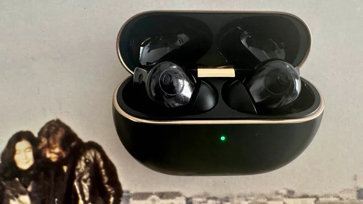 The Huawei FreeBuds 4 Pro wireless earbuds in their charging case with the lid open