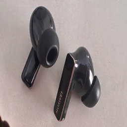 The Huawei FreeBuds 4 Pro wireless earbuds on a white table