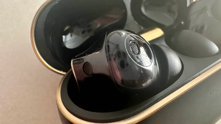 Close-up of the external microphones on one of the Huawei FreeBuds 4 Pro wireless earbuds