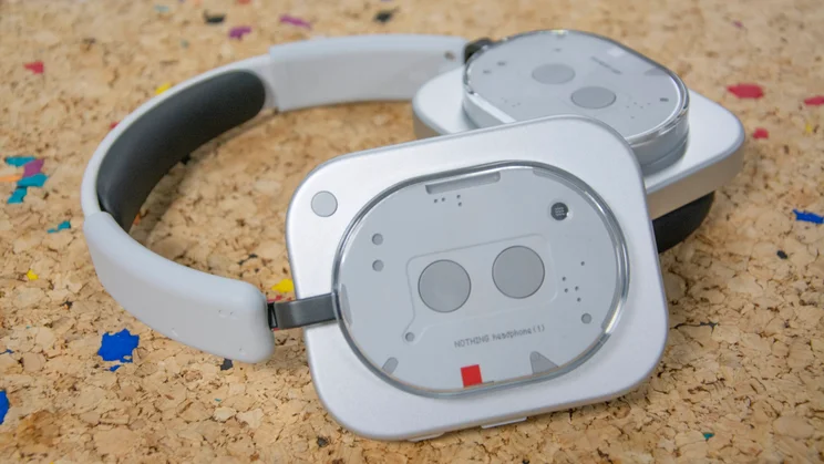 The Nothing Headphone (1) on a cork table with one of the earcups resting on the other