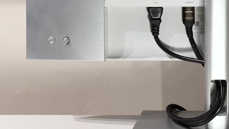 A close up of the Dell UltraSharp U2725QE's cable organiser system