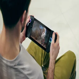 Over the shoulder view of a man gaming on the Asus ROG Xbox Ally