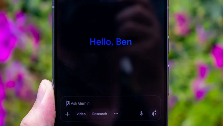 Google Pixel 10 Pro XL in hand, showing Google Gemini chat on the display