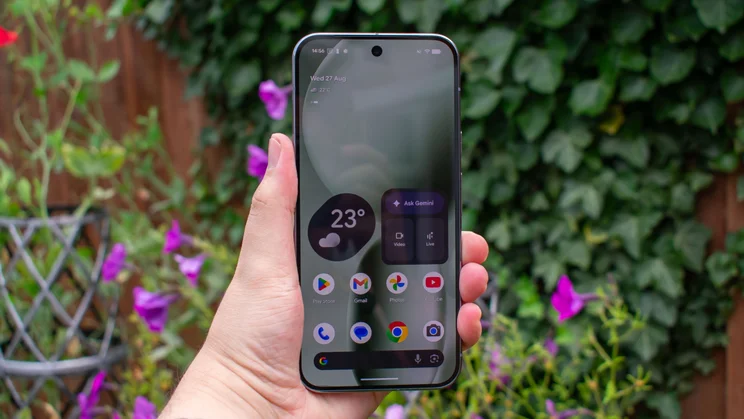 Google Pixel 10 Pro XL in hand, with the display on