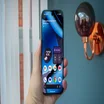Google Pixel 10 Pro in hand, front view, with the display on