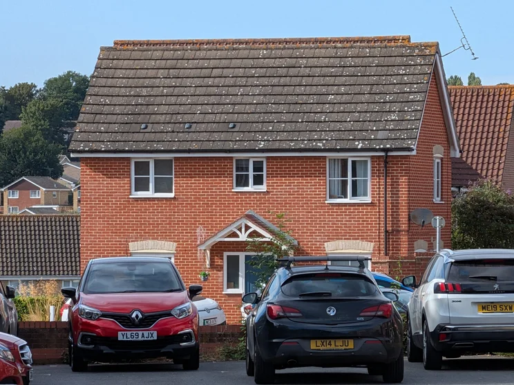 10x zoom of a red house