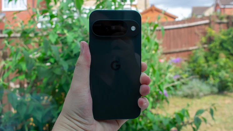 Google Pixel 10 in hand, rear view