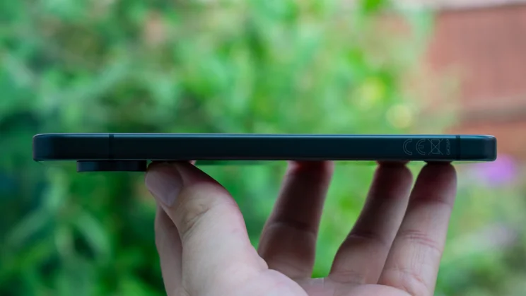 Google Pixel 10 in hand, side view