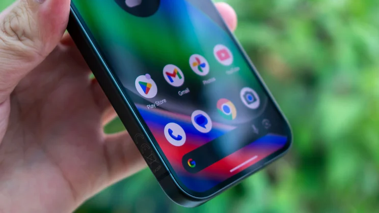 Google Pixel 10 in hand, angled view