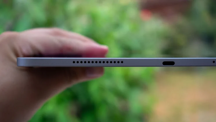 Honor Magic Pad 3 in hand, showing the bottom edge and charging port