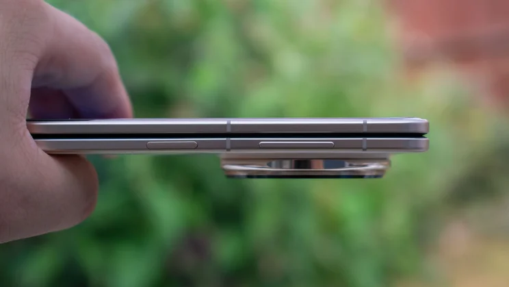 Honor Magic V5 folded in hand, showing the power and volume buttons