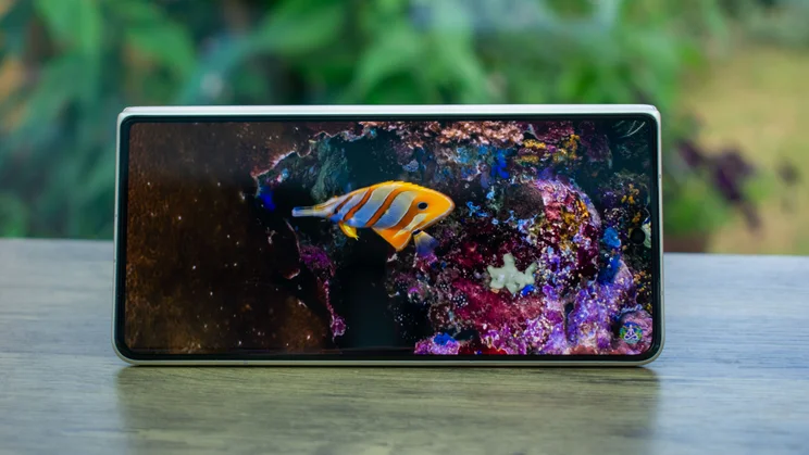 Honor Magic V5 folded in tent mode, showing a video on the cover display