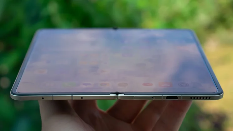 Honor Magic V5 in hand, angled view of the display
