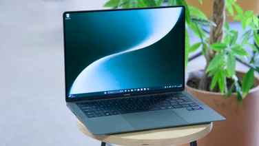 The MagicBook Art 14 (2025) pictured on a stool, open from above left