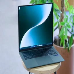 The MagicBook Art 14 (2025) pictured on a stool, open from above left