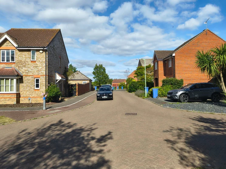 A quiet street with houses on both sides