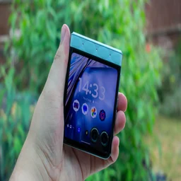 Motorola Razr 60 folded in hand, front view with cover screen on