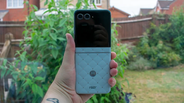 Motorola Razr 60 unfolded in hand, rear view
