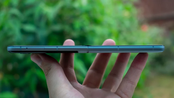 Motorola Razr 60 unfolded in hand, side view
