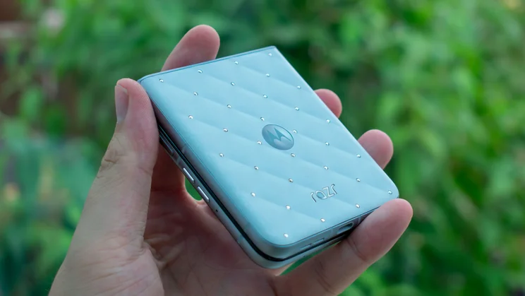 Motorola Razr 60 folded in hand, angled view of the back