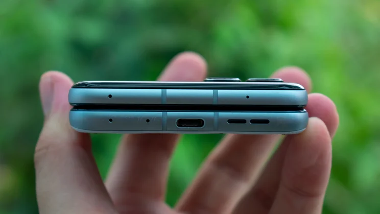 Motorola Razr 60 folded in hand, showing the charging port
