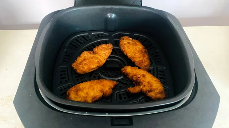 Cooked chicken tenders in the Ninja 5-in-1 Grill and Air Fryer